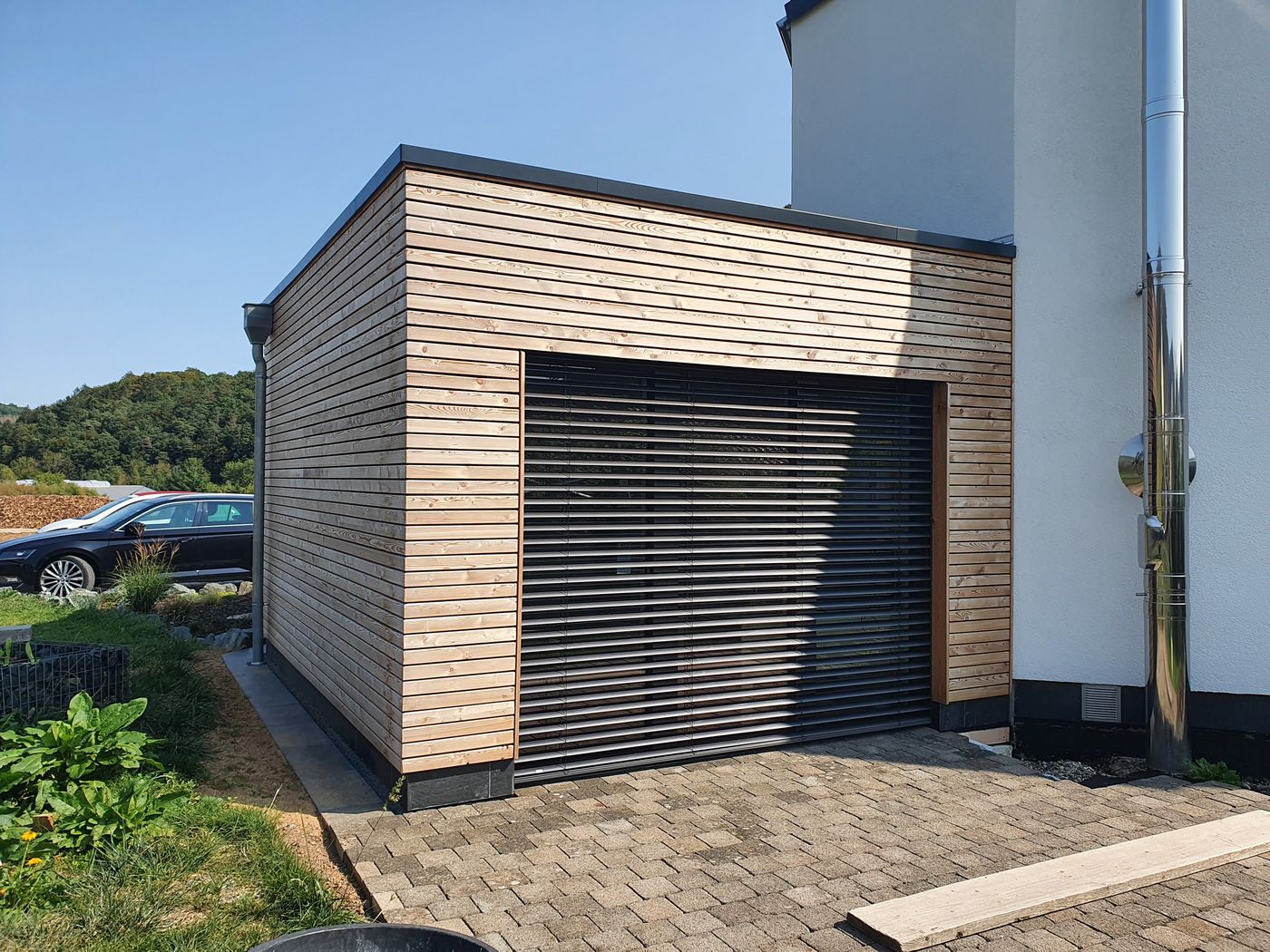Passivhauses in Massivbauweise, Anbau in Holzleichtbauweise